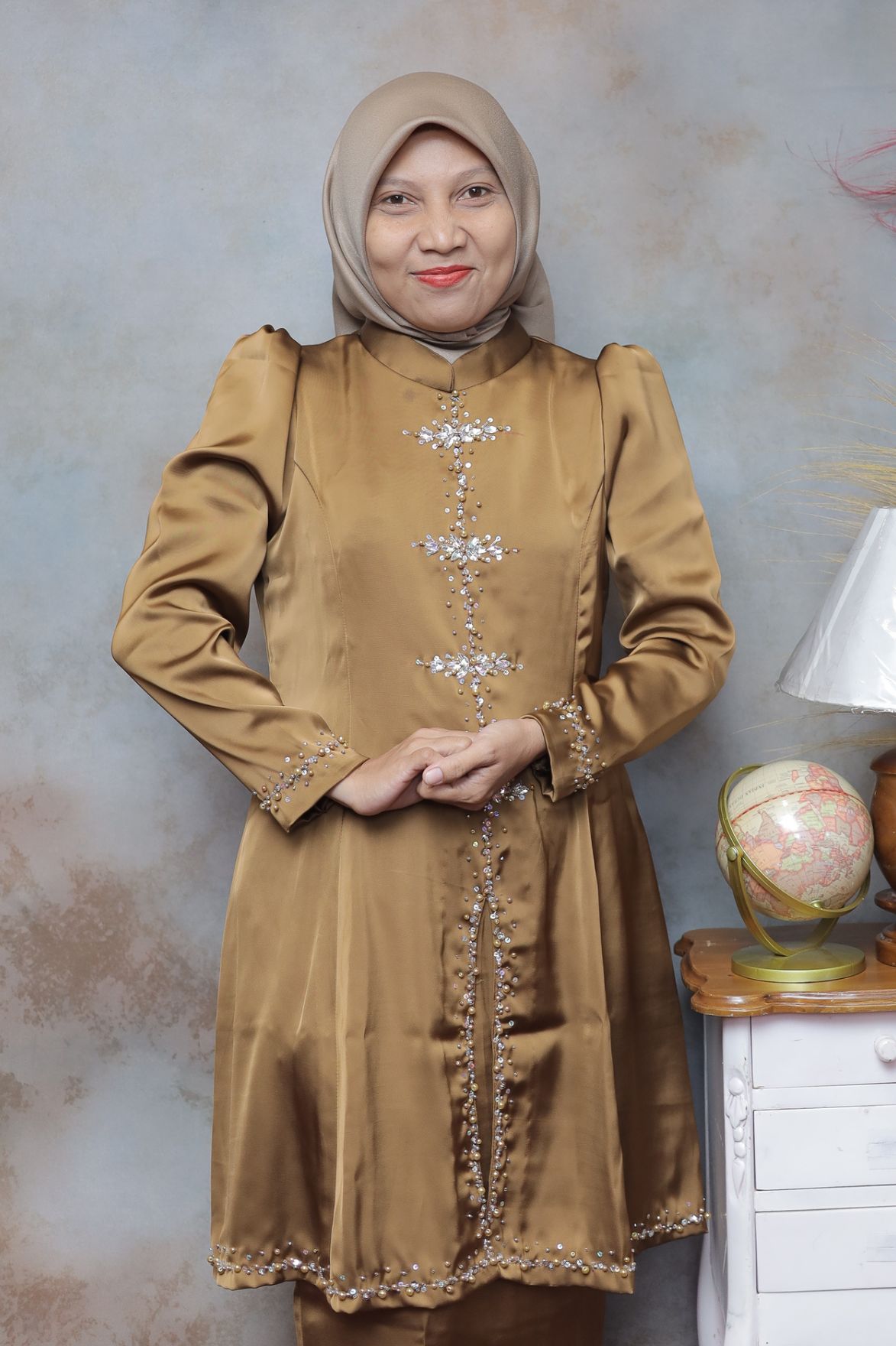Dini Puji Anggraini., M.Pd